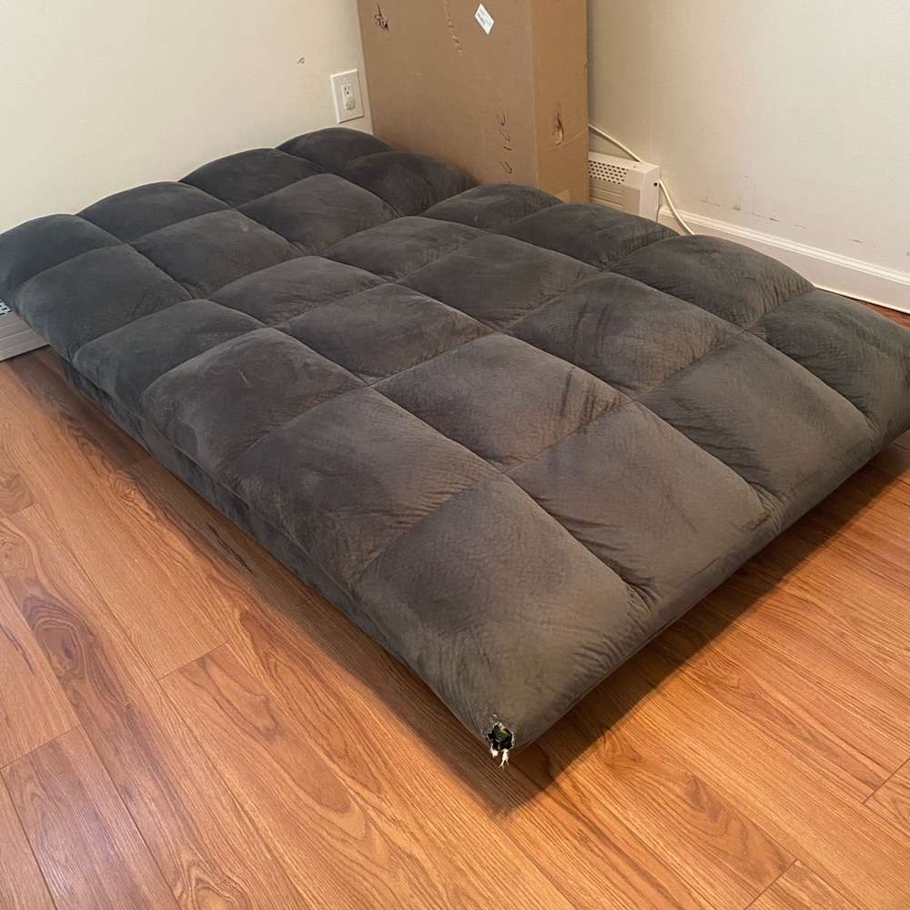 Used Grey reclining Futon. In great condition.